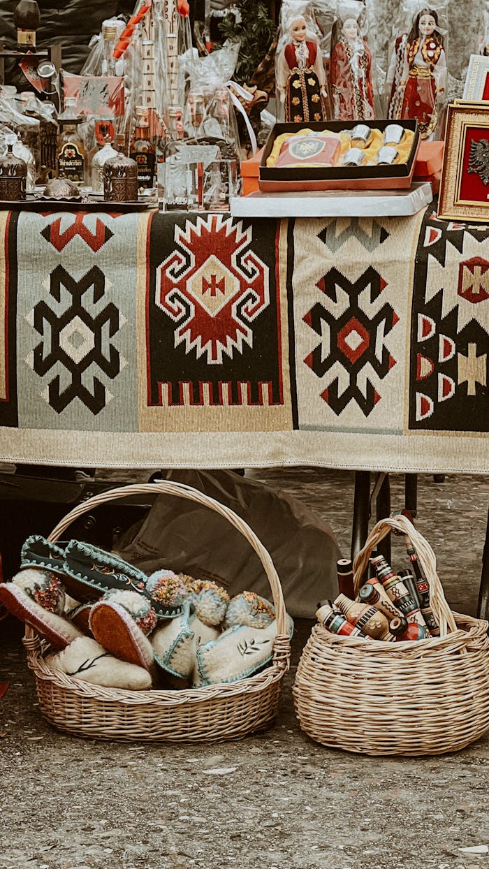 A vivid capture of a traditional market stall with handmade crafts and woven textiles.