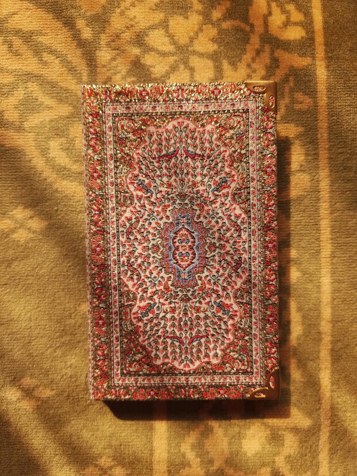 Detailed view of an ornate rug featuring complex patterns and vibrant colors.