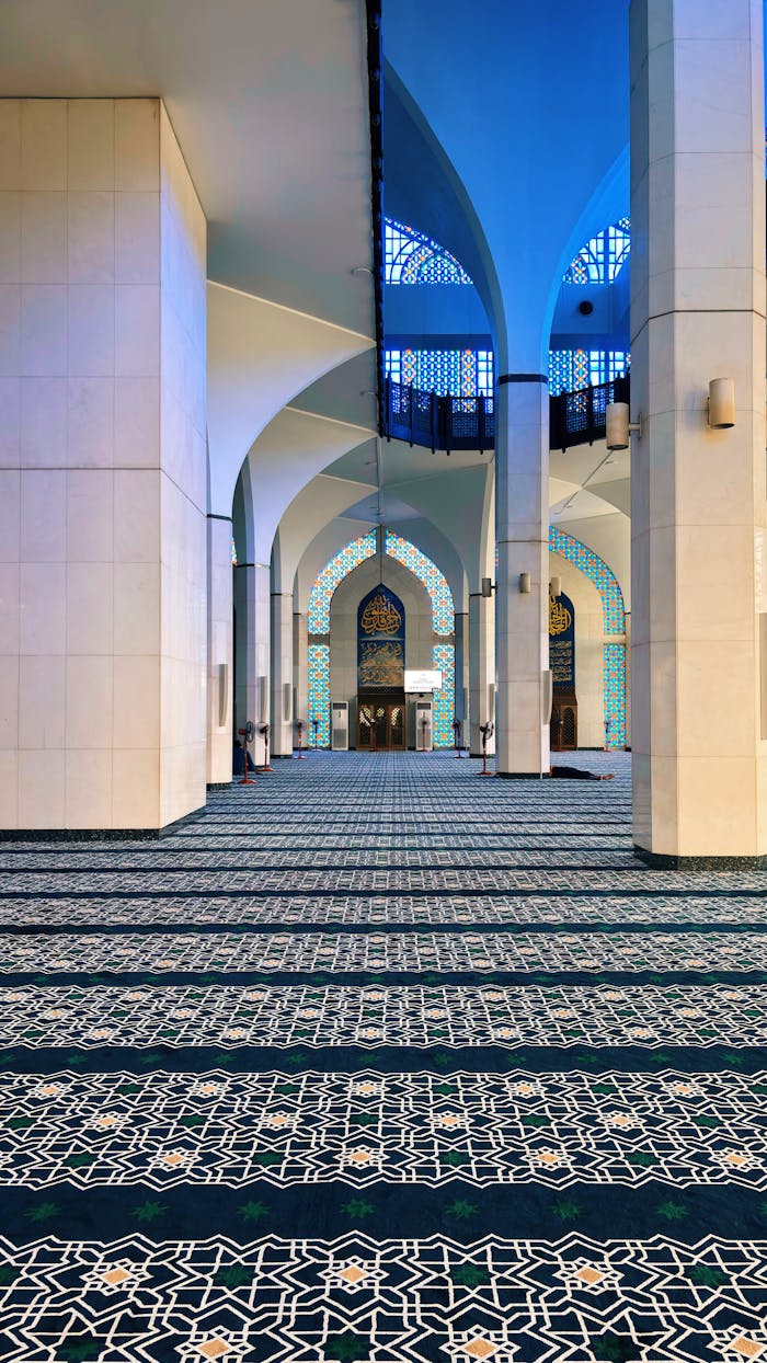 Intricate Islamic patterns inside Shah Alam Mosque, Selangor, showcasing modern architectural beauty.