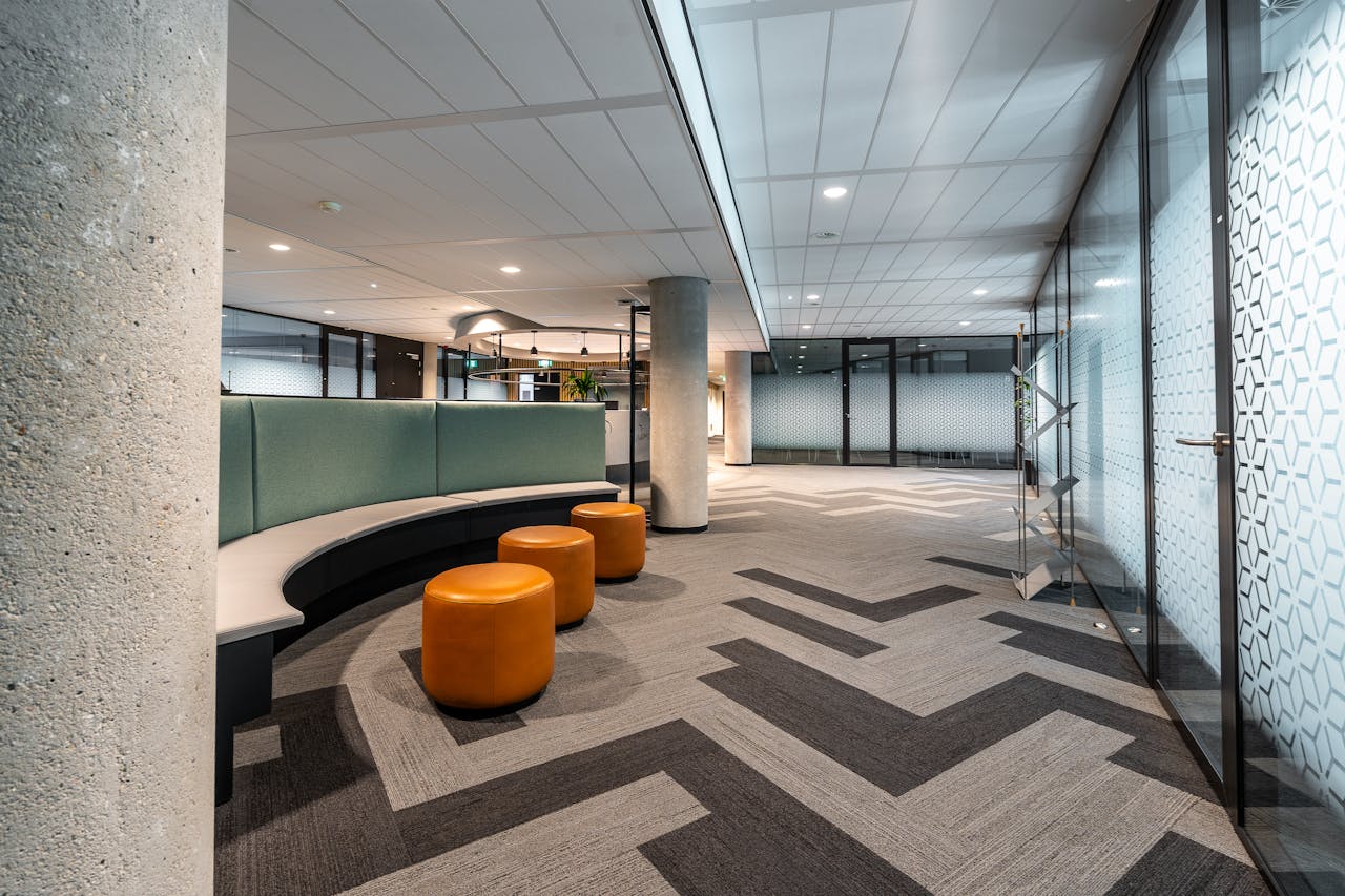 Spacious airport interior featuring modern design, comfortable seating, and ample walking space.