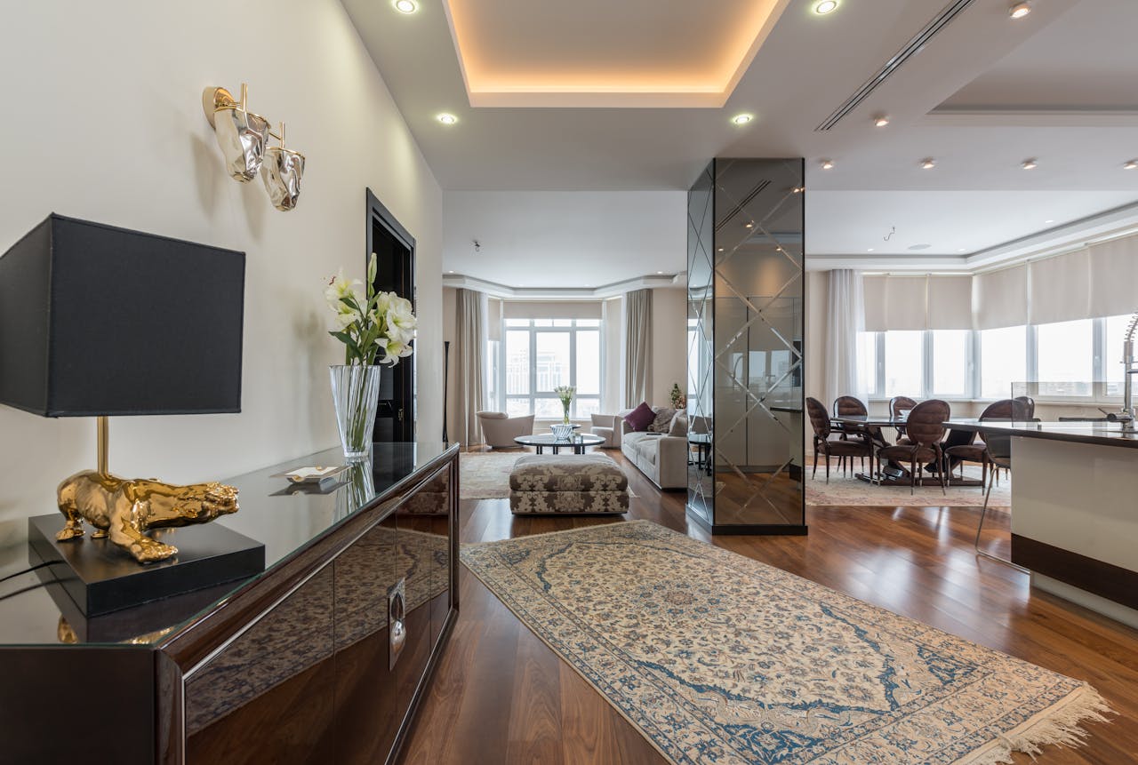Interior of luxury living room with stylish furniture and carpet in modern apartment in daytime